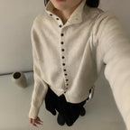 Jersey de cuello alto con botones Ingrid en color crudo
